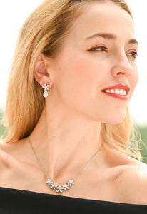 Radiant Bloom Platinum and Zircon Drop Earrings